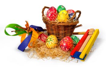 Colored,Easter,Eggs,In,In,A,Wicker,Basket
